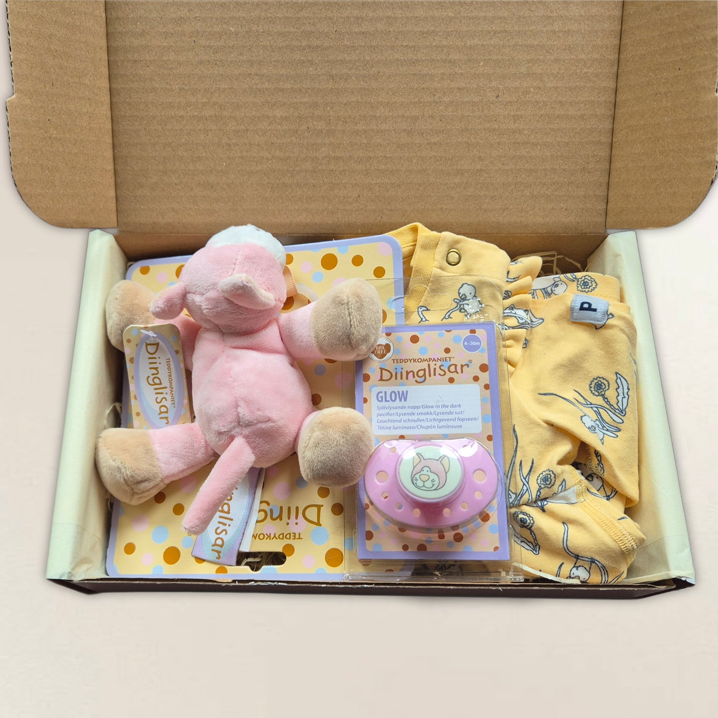 Gul klänning, dinglis och napp. Strl. 56